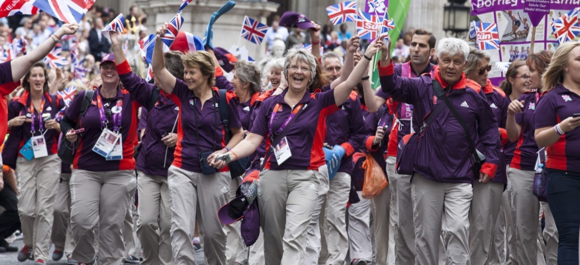 Giving volunteers pre-loaded Olympics smart travel and accreditation cards